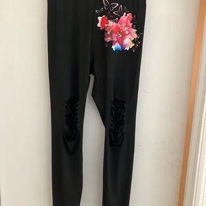 Ladies custom made leggins.  NWOT. Never worn.   Butterfly design on left leg.